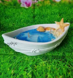 נר בצורת סירה עם ריח חוף ים